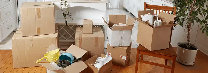 Packed moving boxes and household items in a kitchen before move-out or move-in cleaning, Louisville, KY.